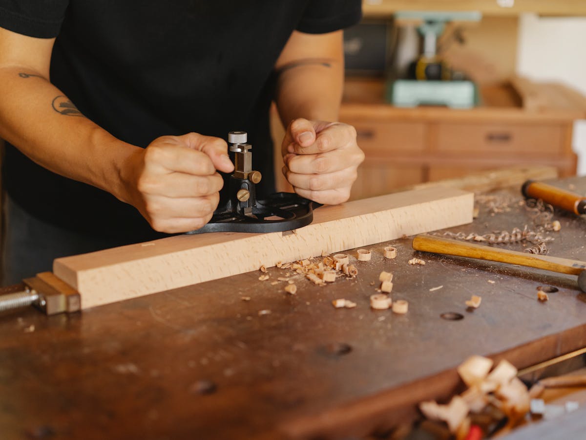 Hand-routed door rail detail in the Deelux workshop