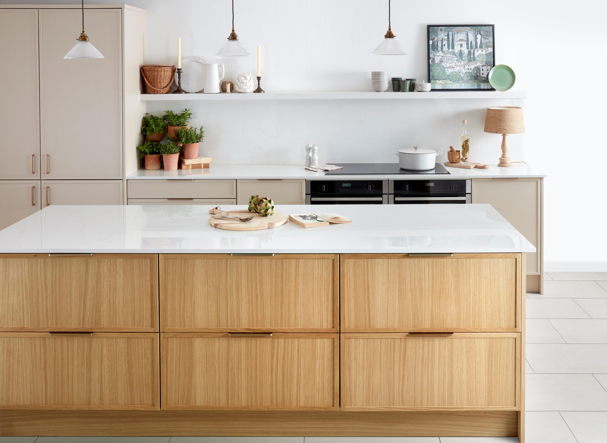 A Deelux hand-painted Shaker fitted kitchen with island, pendant lighting and quartz worktop in a Cheshire home